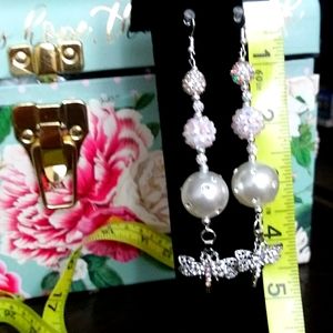 These are made by me. Long Dangling beautiful Firefly earrings.